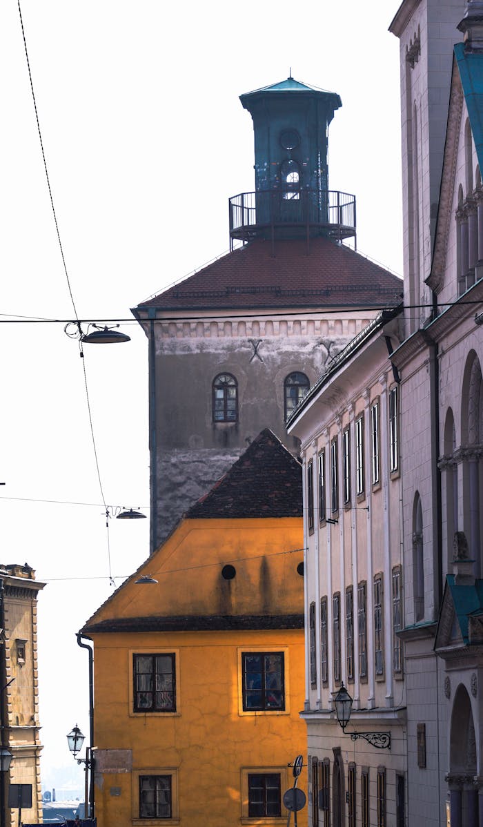 Sunlit street view of historic buildings and architecture in Zagreb, Croatia.